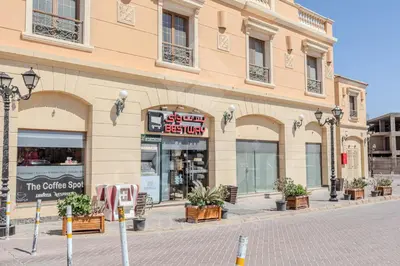 a store on a street in front of a building at Ladybird - Veranda Nest in Hurghada