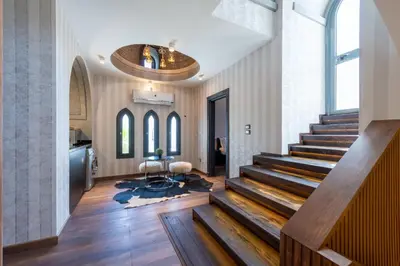 a lobby with a staircase and a large ceiling at Sahlhasheesh villa with heated pool and Jacuzzi in Hurghada