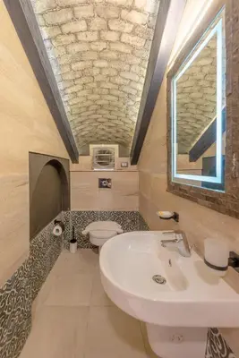 a bathroom with a sink and a toilet at Sahlhasheesh villa with heated pool and Jacuzzi in Hurghada