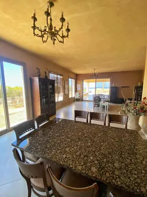 a dining room with a table and chairs at Luxury Sea-View Villa with Private Pool with Diving center & Beach access in Marsa Alam