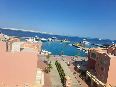 a view of a harbor with boats in the water at Amazing Roof In Marina Hurghada in Hurghada