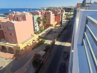 an aerial view of a city street with buildings at Amazing Roof In Marina Hurghada in Hurghada