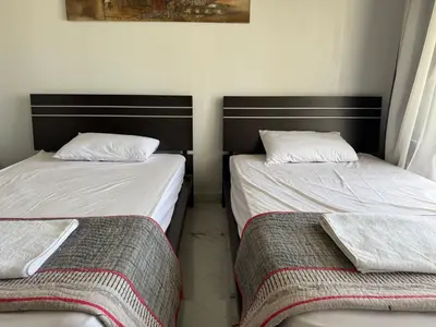 two beds sitting next to each other in a room at NEXT STAY, 3BR Villa, El Gouna in Hurghada