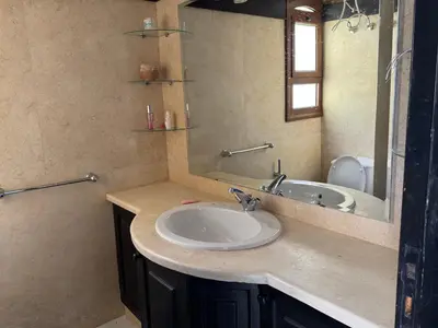 a bathroom with a sink and a mirror at NEXT STAY, 3BR Villa, El Gouna in Hurghada