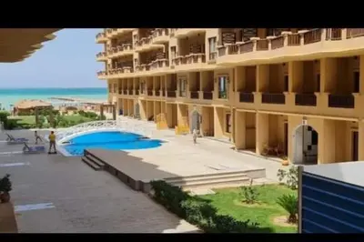 a large apartment building next to the beach at Studio in turtels beach in Hurghada