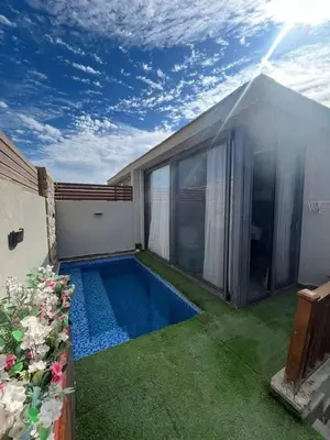 a small swimming pool in the backyard of a house at One Bedroom Apartment in El Gouna Bali in Hurghada