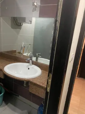 a bathroom with a sink and a mirror at Sea View Apartment Cecelia Resort in Hurghada