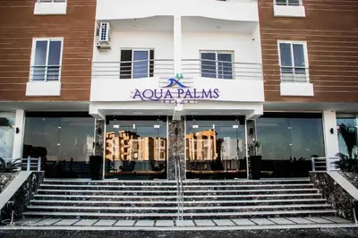a building with the front door of a building with stairs at Flat in Hughada Aqua Palms 52 M2 in Hurghada