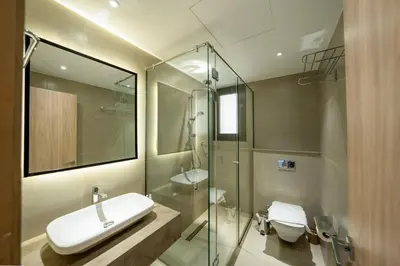 a bathroom with a sink and a toilet and a shower at Elegant Fanadir Marina 2BR • Ground Floor in Hurghada