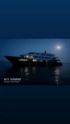 a large boat sitting in the water at night at Supperyacht Jack Sparrow in Hurghada