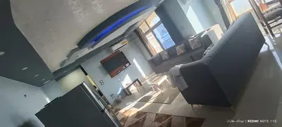 an overhead view of a living room with a large blue frisbee at شقة كورنيش النيل 3غرف فيو كامل علي النيل in Aswan