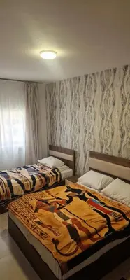 a bedroom with two beds in a room at Blue Dream in Hurghada