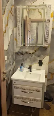 a bathroom with a sink and a mirror at Blue Dream in Hurghada