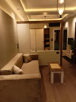a living room with a couch and a table at Palma House in Hurghada