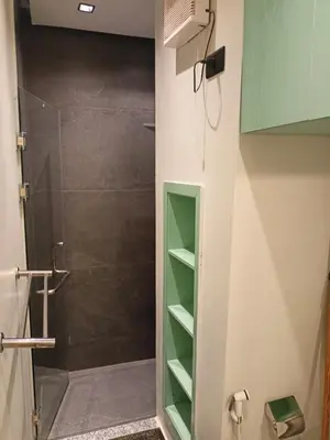 a shower with a glass door in a bathroom at Palma House in Hurghada