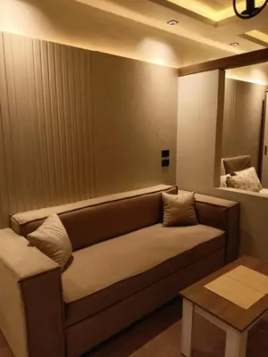 a living room with a couch and a table at Palma House in Hurghada