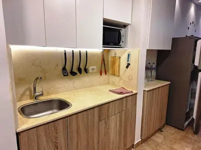a kitchen with a sink and a counter top at Florenza Khamsin, Studio i415-B in Hurghada