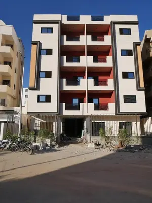 a tall building in the middle of a street at مبارك 5 in Hurghada