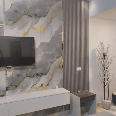 a living room with a tv on a wall at Florenza khamsin Resort Hurghada Red Sea in Hurghada