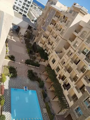 an overhead view of a building with a swimming pool at Florenza khamsin Resort Hurghada Red Sea in Hurghada