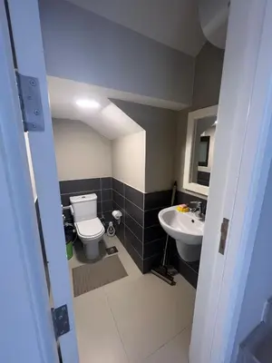 a bathroom with a toilet and a sink at Tawila 3BR Family Townhouse • Lagoon Retreat Villa in Hurghada
