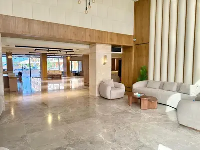 a lobby with couches and tables in a building at Selena Bay Boutique Hotel in Hurghada
