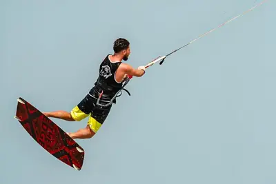 a man is in the air on a surfboard at Selena Bay Boutique Hotel in Hurghada