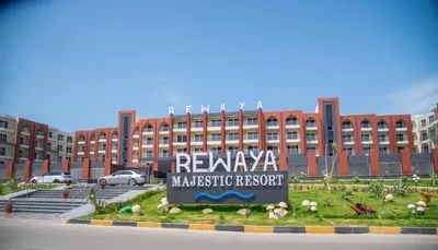 a large building with a sign in front of it at Rewaya Majestic Resort in Hurghada