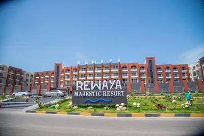 a large building with a sign in front of it at Rewaya Majestic Resort in Hurghada