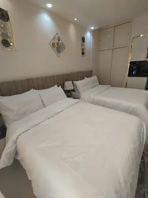 two beds in a hotel room with white sheets at Florenza khamsin Resort Hurghada Red Sea in Hurghada