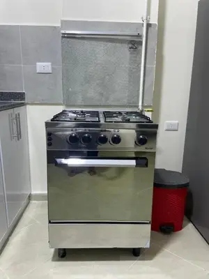 a stainless steel stove in a kitchen with at Bayt Hassan A7 - fabulous 2 bedrooms apartment in Hurghada