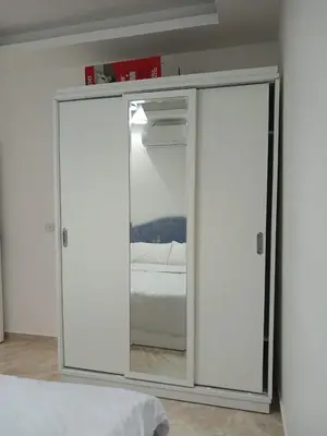 a white closet with a bed in a room at Selena Bay Resort in Hurghada