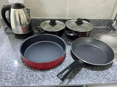 a kitchen counter with two pans and pots on it at Bayt Hassan S6 - Cosy 1 bedroom apartment in Hurghada