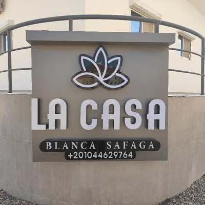 a sign for a la casa blanca sazona at Ocean Apartment in Hurghada
