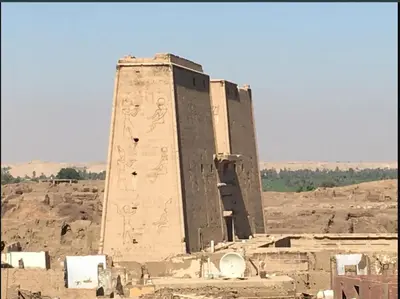a building with paintings on it in the desert at El Massa in Idfu