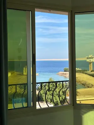 a view of the ocean from a window at Arabia Sea View in Hurghada