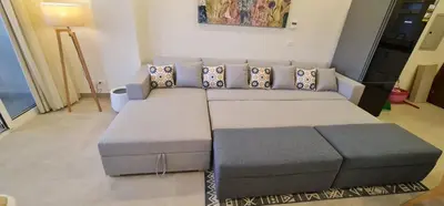 a living room with a couch and a table at The dune Terrace in Hurghada