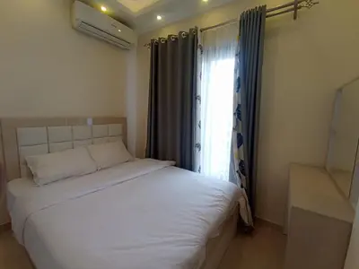 a bedroom with a white bed with a window at 2 bed Flat, Hurghada, long&short in Hurghada