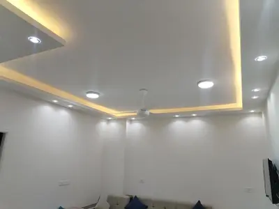 a room with white walls and a ceiling with lights at Dream House in Hurghada