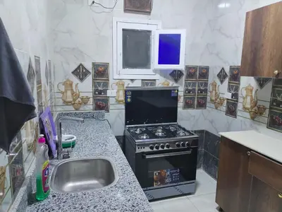 a kitchen with a stove and a sink at Dream House in Hurghada