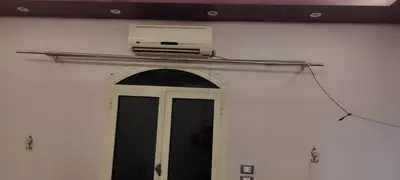 a room with a door with a air conditioner above it at Souzan house in Luxor