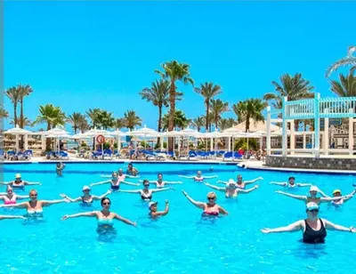 a group of people in the swimming pool at a resort at Mirage Aqua Park Villa in Hurghada