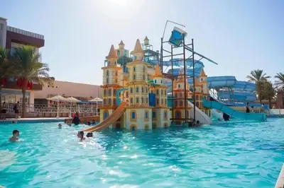 a castle in the water in a swimming pool at Mirage Aqua Park Villa in Hurghada