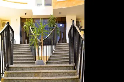 a set of stairs with a black fence at One bedroom apartment with a hall in Aqua Infinity Resort before El Gouna in Hurghada