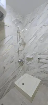 a bathroom with a shower with a toilet in it at Tiba Golden Red Sea Coral Hurghada in Hurghada
