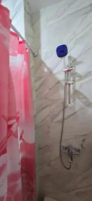 a shower with a shower head in a bathroom at Tiba Golden Whire Sands Hurghada in Hurghada
