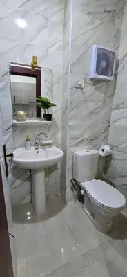 a bathroom with a toilet and a sink at Tiba Golden Private Beach Hurghada in Hurghada