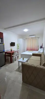 a living room with a couch and a bed at Tiba Golden Crystal Oasis Hurghada in Hurghada