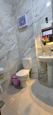 a bathroom with a toilet and a sink at Tiba Golden Golden Coast Hurghada in Hurghada