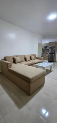 a living room with a couch and a table at Tiba Golden Amber Sands Hurghada in Hurghada